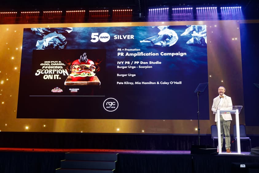 BADC 50th Awards — presenter at lectern on stage